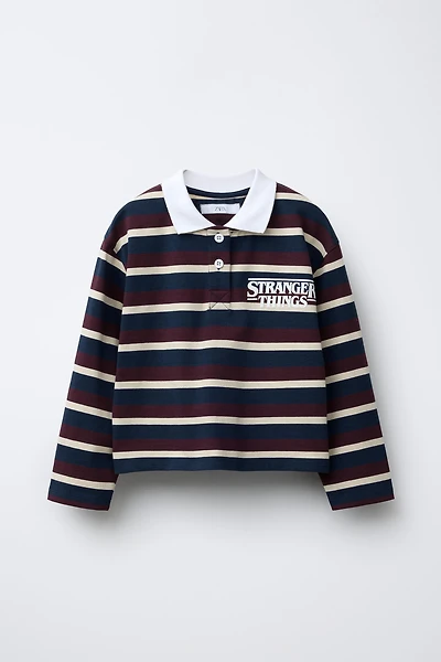 STRIPED STRANGER THINGS © NETFLIX POLO SHIRT
