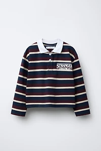 STRIPED STRANGER THINGS © NETFLIX POLO SHIRT