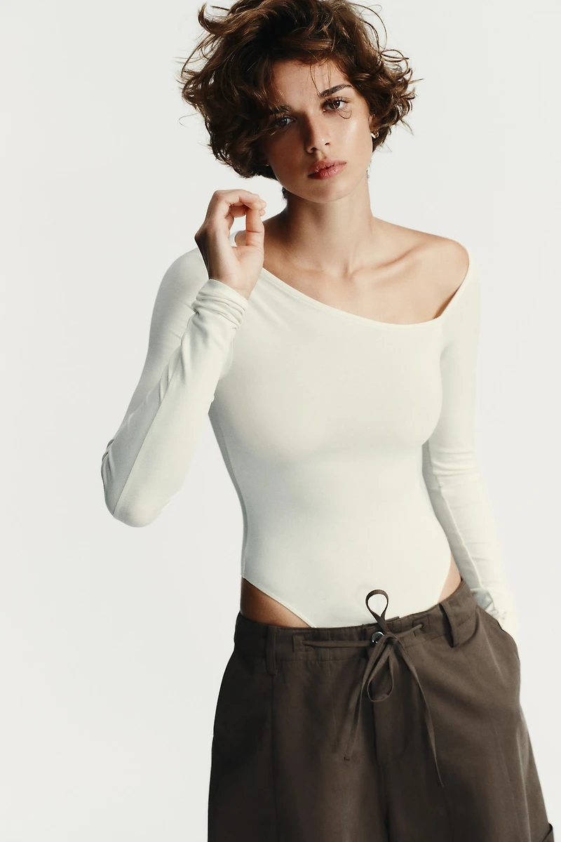 ASYMMETRIC LONG SLEEVE BODYSUIT
