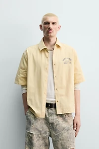 PRINTED TEXT BOXY FIT SHIRT