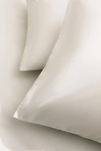 TAIE D’OREILLER OVERLOCK