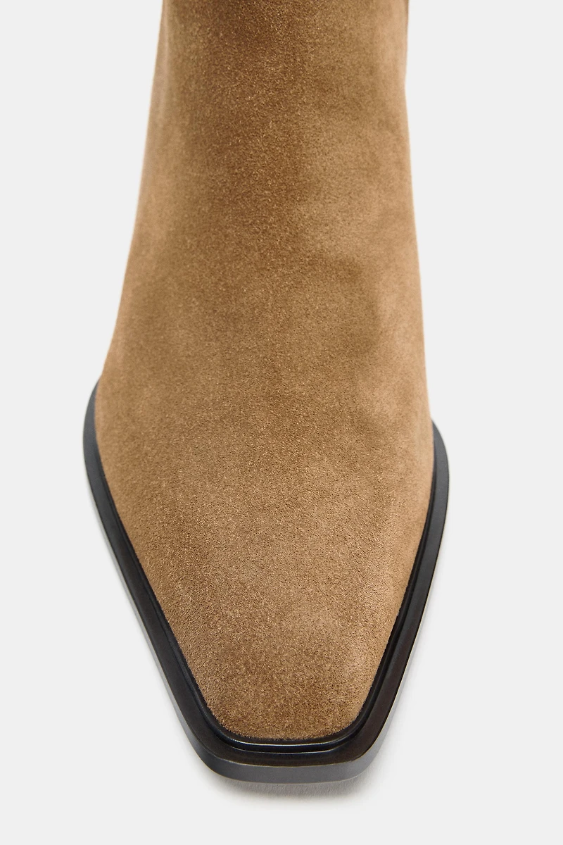 BOTTINES À TALONS EN CROÛTE DE CUIR