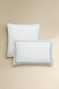 TAIE D’OREILLER BRODERIE BORDURE