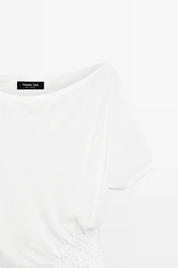 Asymmetric top with embroidered detail