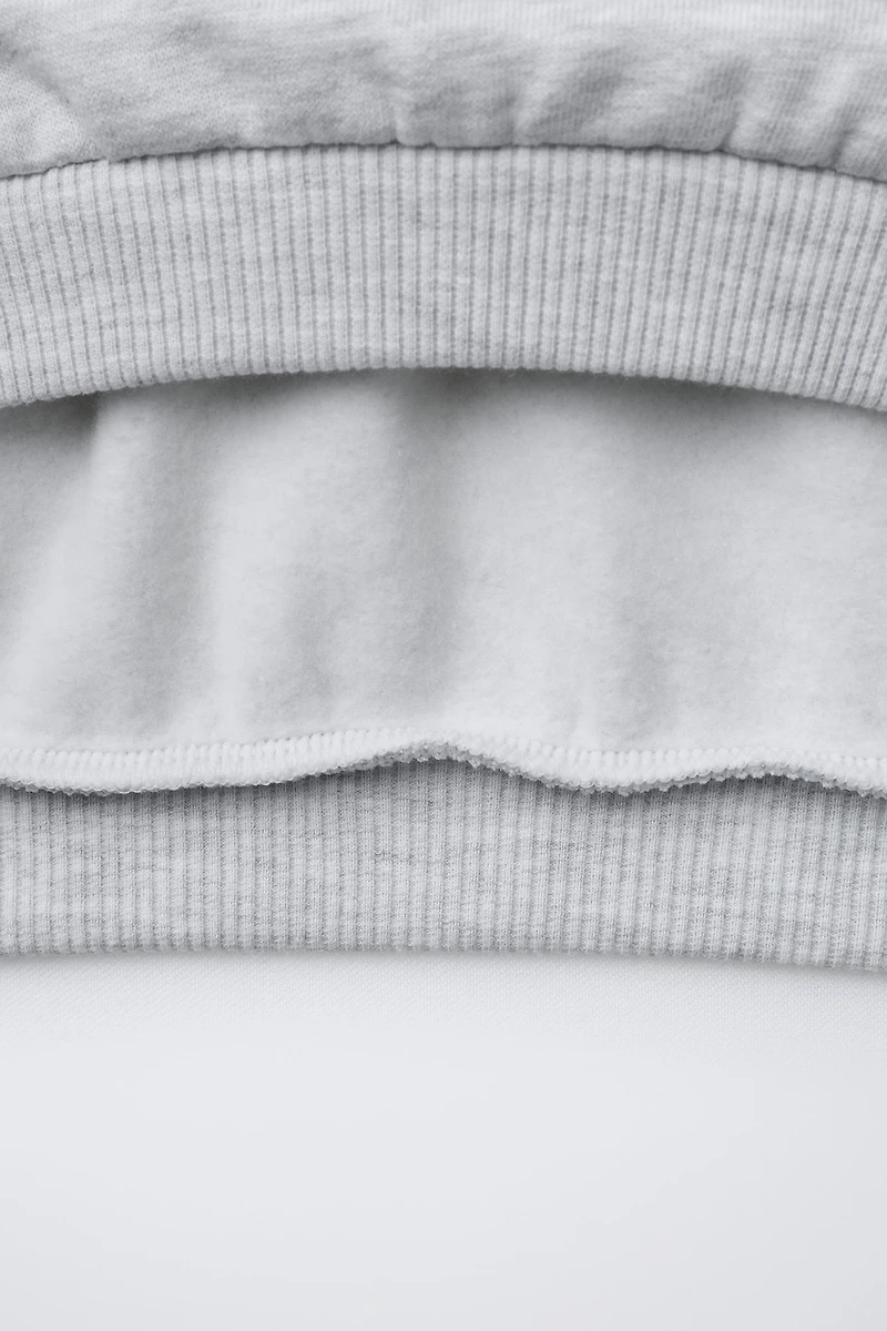 SWEAT AVEC PIÈCES