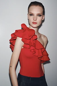 ASYMMETRIC BODYSUIT WITH CONTRASTING RUFFLE