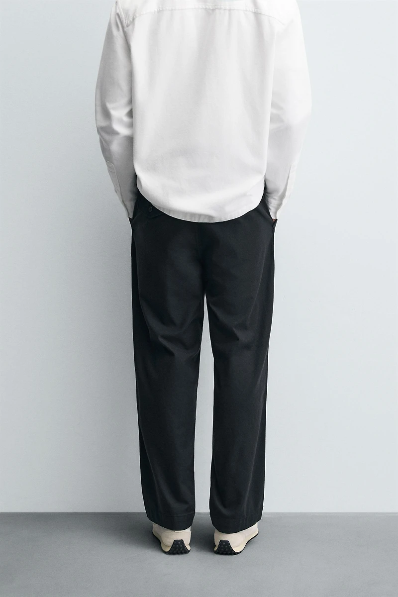 RELAXED FIT PLEATED PANTS