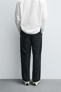 RELAXED FIT PLEATED PANTS