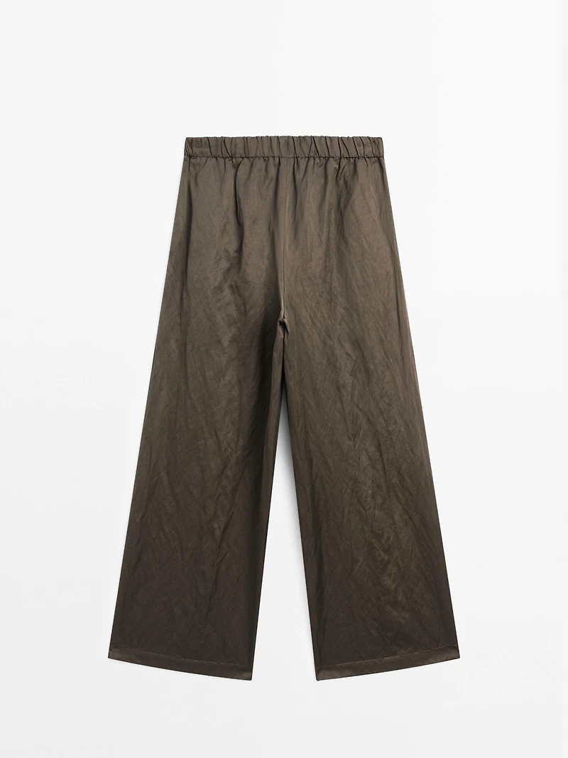 Wide-leg satin trousers with creased effect