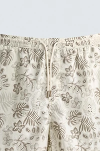 LONG FLORAL PRINT SWIM SHORTS