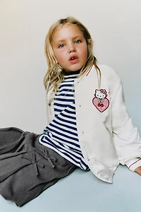 JUPE-SHORT PLIS PLATS LACETS