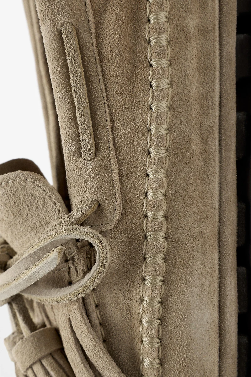 Leather loafers with fringing and tassels