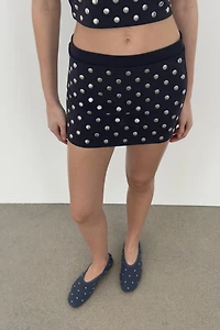 MINI JUPE À CLOUS