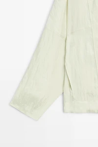 Fluid wrap shirt with button detail