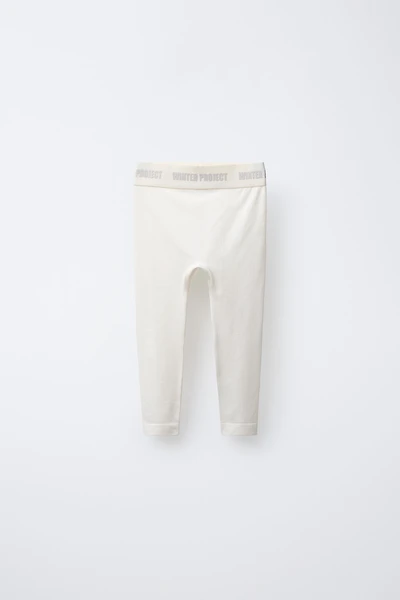 EMBOSSED TEXT RIBBED LEGGINGS