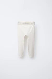EMBOSSED TEXT RIBBED LEGGINGS