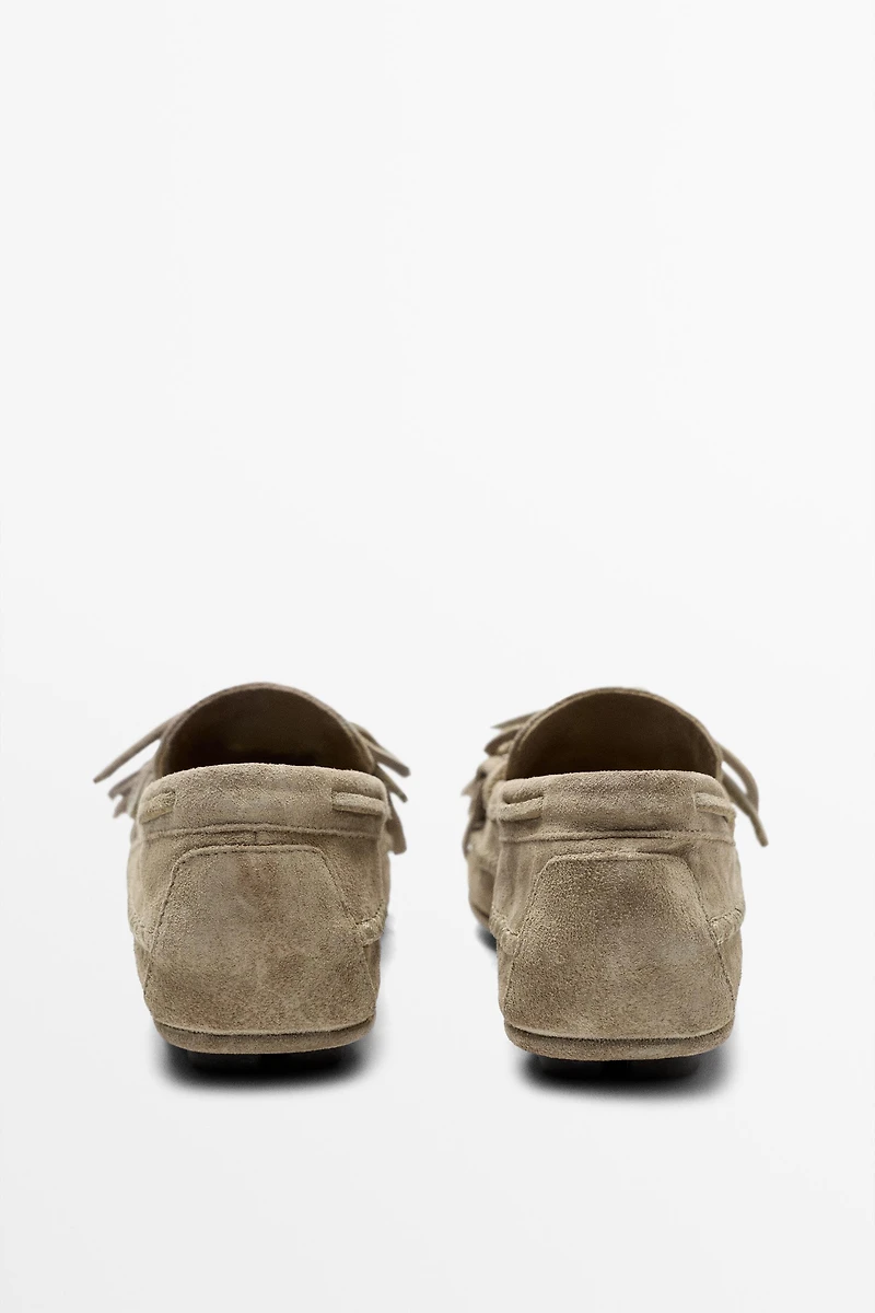 Leather loafers with fringing and tassels
