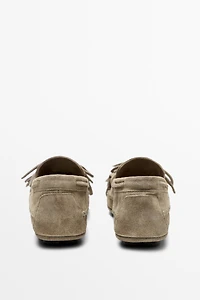 Leather loafers with fringing and tassels
