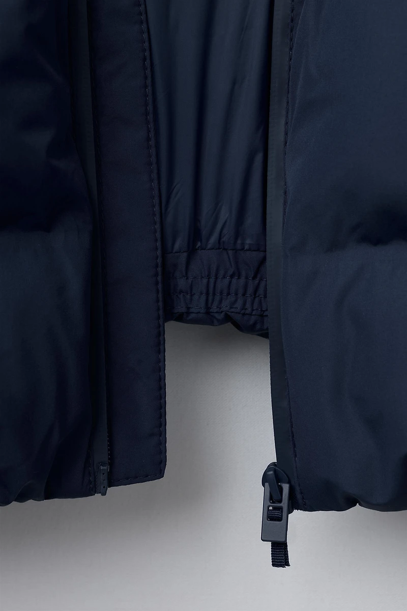 MANTEAU REMBOURRÉ ÉTIQUETTE DÉPERLANT