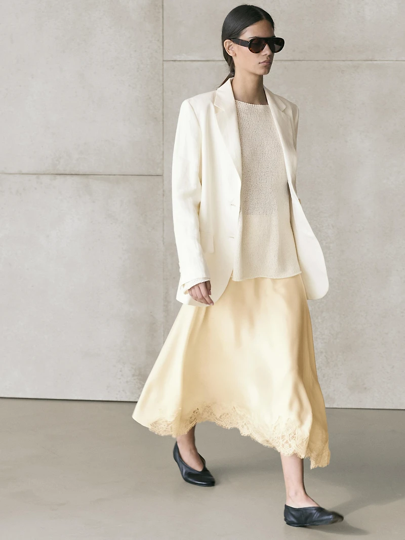Asymmetric skirt with lace-trimmed detail