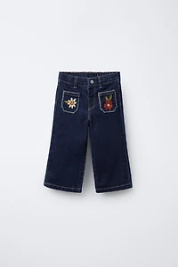 EMBROIDERED POCKET NAVY JEANS