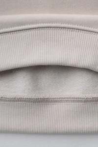 RAISED TEXT SWEATSHIRT