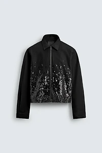 VESTE COURTE À PAILLETTES