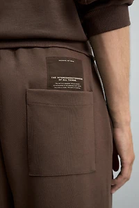 PANTALON INTERLOCK ÉTIQUETTE