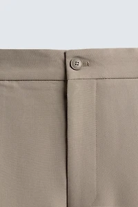 PANTALON RELAXED FIT À PLIS