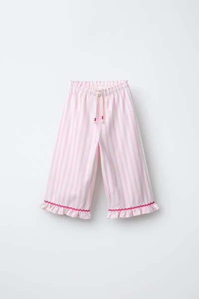 PANTALON À RAYURES TISSÉES ET VOLANTS