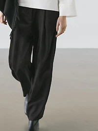 Flowing trousers with pleated details