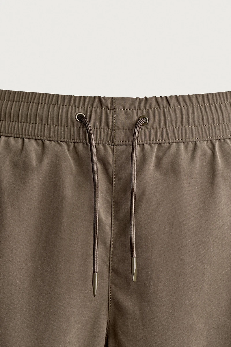 BASIC LONG SWIM TRUNKS