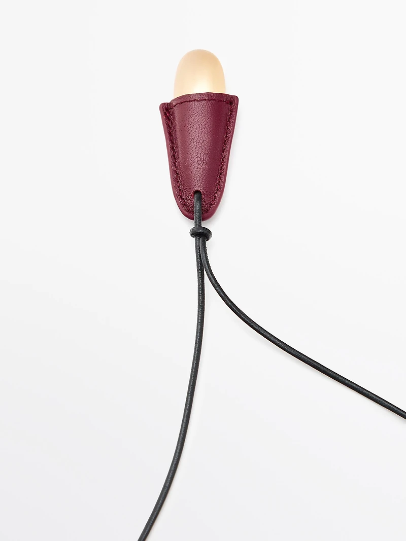 Pendentif pièce en cuir