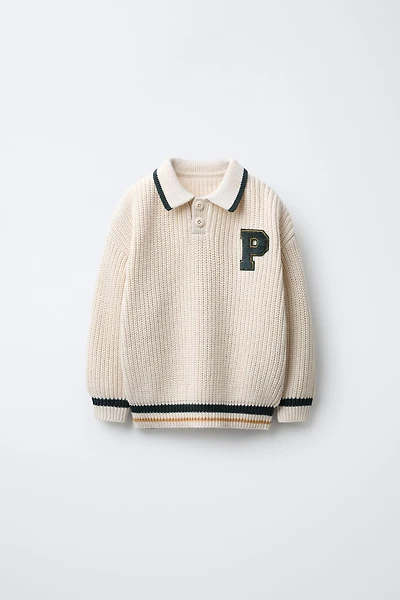 PULL EN MAILLE VARSITY AVEC PIÈCE