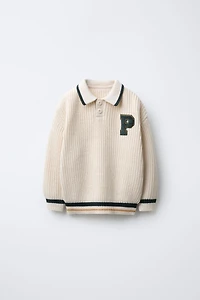 PULL EN MAILLE VARSITY AVEC PIÈCE