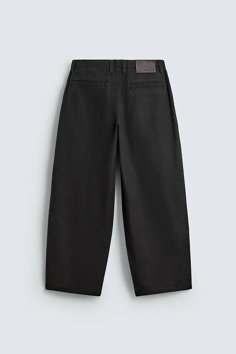 WIDE FIT PLEATED PANTS