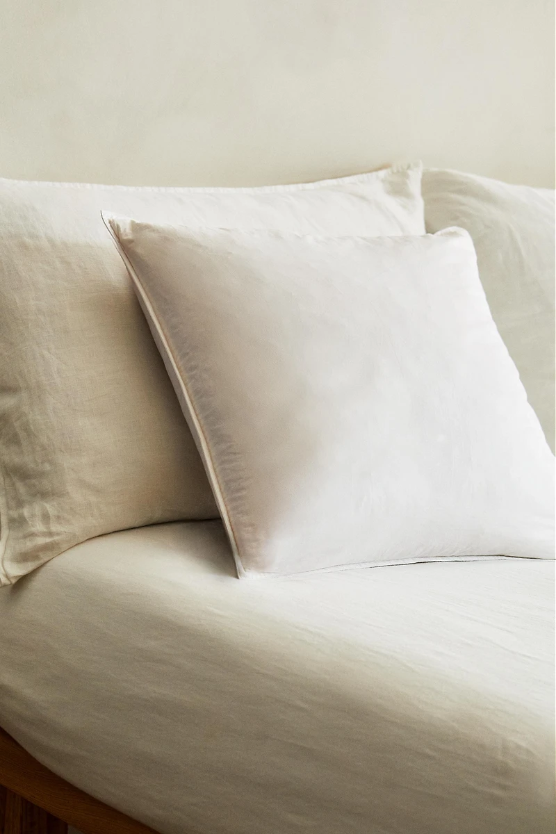 FEATHER CUSHION FILLING WITH A COTTON COVER