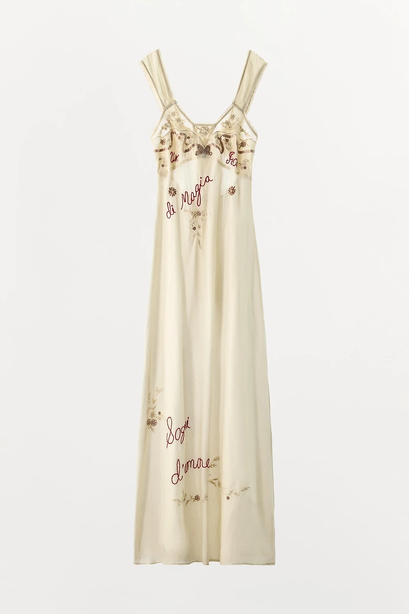 DRESS WITH EMBROIDERY, TEXT, AND BEADING