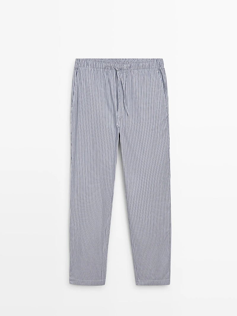 Short sleeve pyjama top and striped trousers