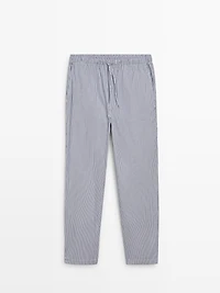 Short sleeve pyjama top and striped trousers