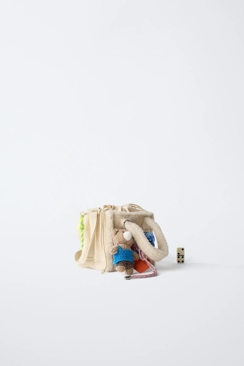SAC BANDOULIÈRE EN PEAU DE MOUTON CHARM