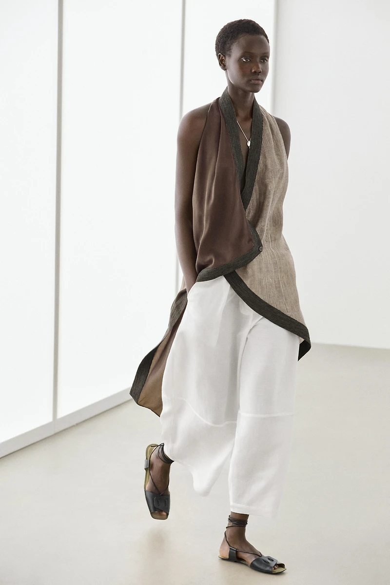 Flowing wrap top with mixed fabric detail