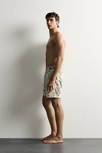 LONG FLORAL PRINT SWIM TRUNKS