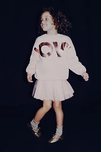 SWEAT À INSCRIPTION BRILLANTE