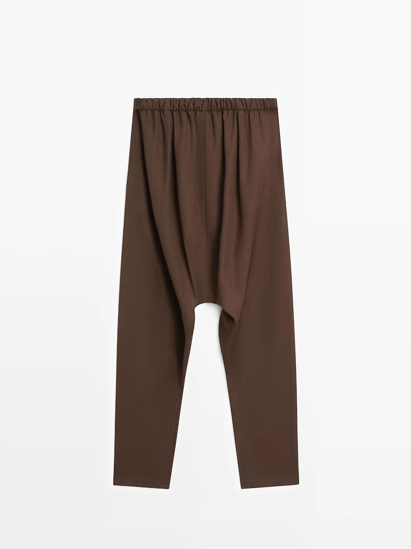 Baggy trousers with pleated details