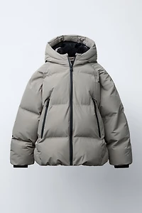 MANTEAU MATELASSÉ ZIPS DÉPERLANT