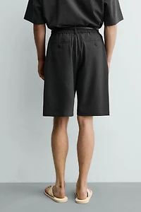 IRREGULAR TEXTURE PLEATED SHORTS