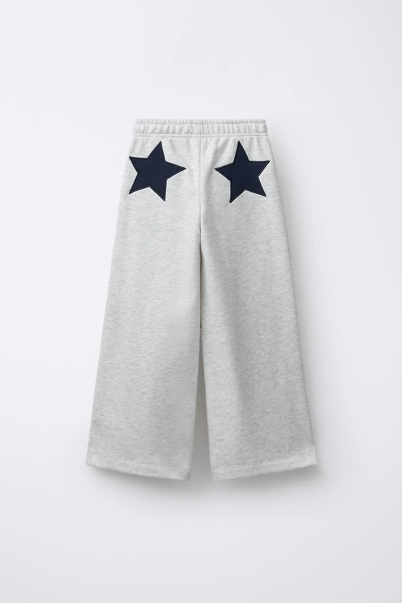 PANTALON EN MOLLETON À JAMBES LARGES ÉTOILES