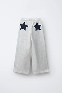 PANTALON EN MOLLETON À JAMBES LARGES ÉTOILES