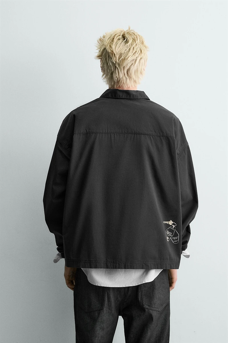 EMBROIDERED ZIP POLO SHIRT